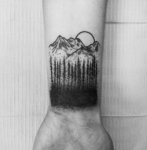 02-Tattoo-on-the-wrist-of-the-guy-the-mountains-and-the-woods.jpg