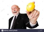 business-man-holding-lemon-BJP6FE.jpg