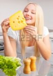 10555893-beautiful-young-blond-woman-with-salad-and-cheese-in-the-kitchen-at-home.jpg